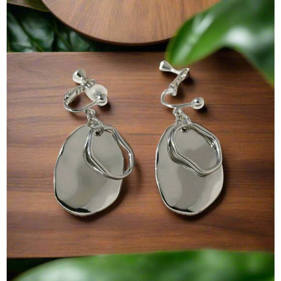 Clip on 1 3/4" shiny silver odd shaped layered dangle earrings - Picture 2 of 4